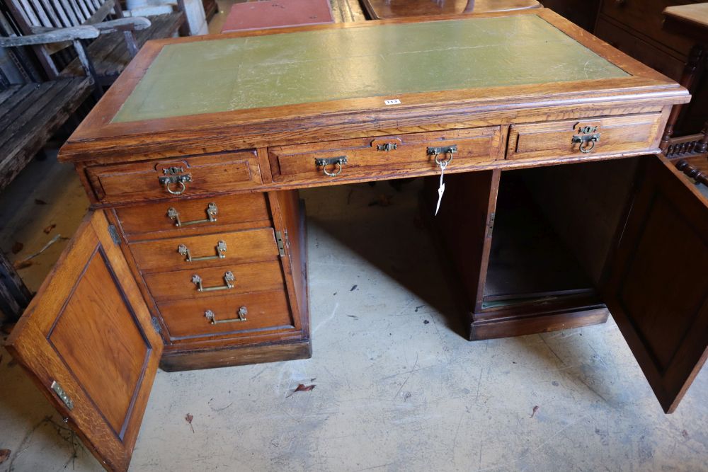 An early 20th century oak pedestal desk, width 136cm